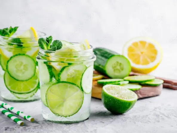 Image of to glasses of water with lemon, lime and cucumber in them 