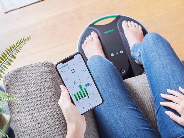 woman using medic coach with the app on her phone 