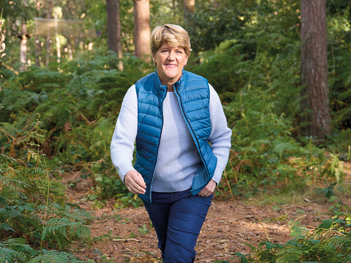 Clare Balding walking outdoors with a smile - showcasing leg health and mobility