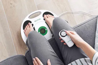 womans feet on a device
