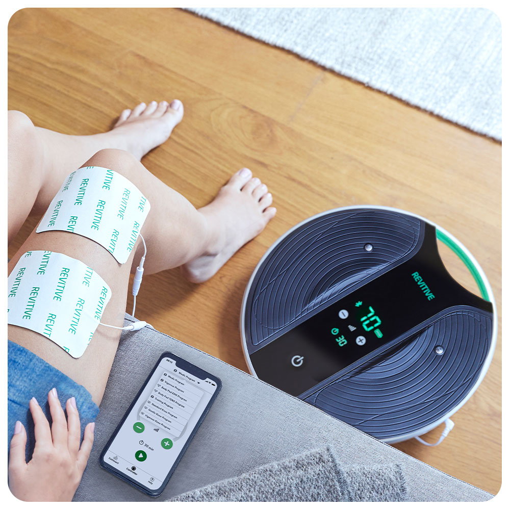 Medic coach on the floor with a woman next to it using thigh pads