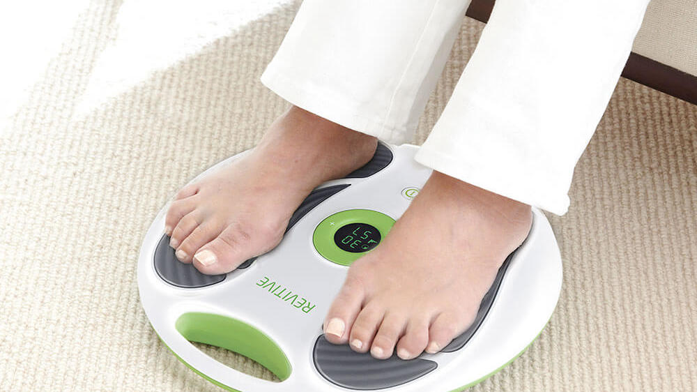 A person using Revitive in a living-room