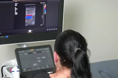 A person having ultrasound on their leg.