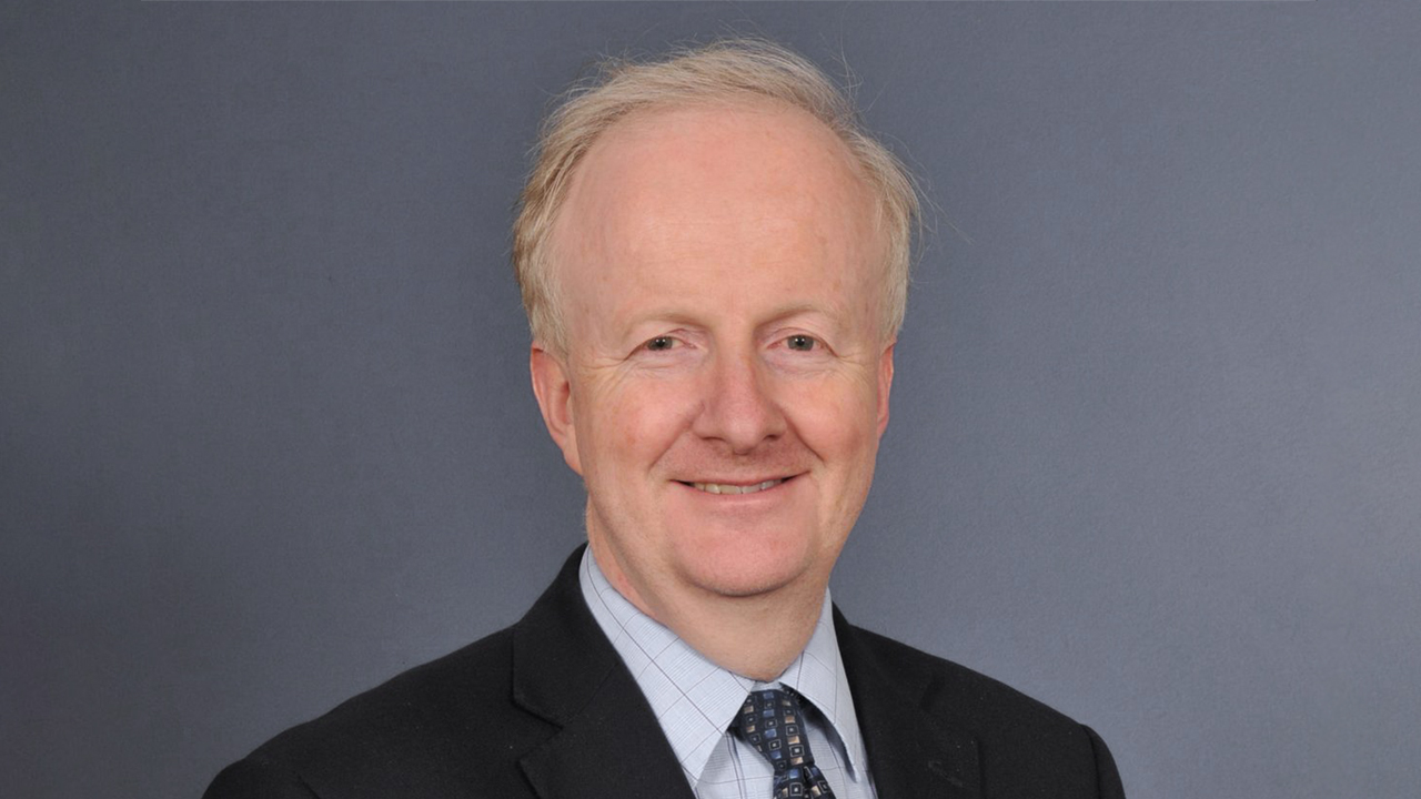 Alun Davies smiling at the camera 