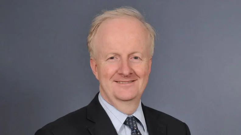 Alun Davies smiling at the camera