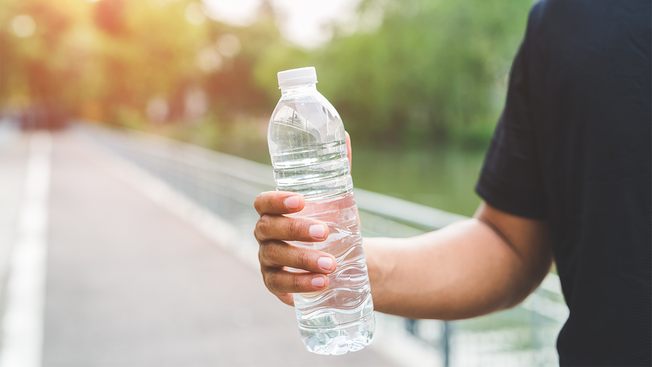 Image of a person holding a water bottle 