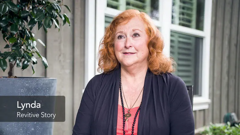 Image of Lynda smiling and talking to the camera